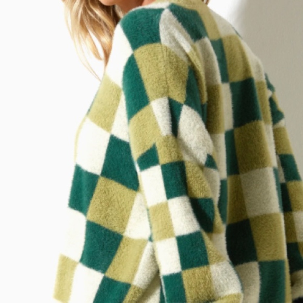 Sweater by Motel,S soft with loose fit. Long sleeves green and cream checkered!